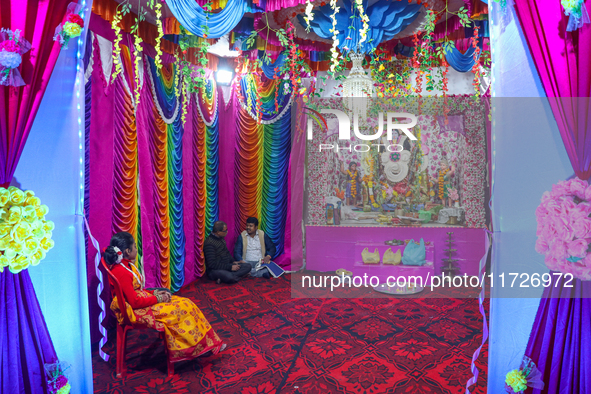 Non-local Hindus sit inside a temple on the day of Diwali in Srinagar, Indian Administered Kashmir, on October 31, 2024. 