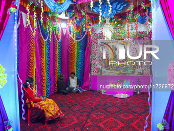 Non-local Hindus sit inside a temple on the day of Diwali in Srinagar, Indian Administered Kashmir, on October 31, 2024. (