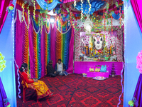 Non-local Hindus sit inside a temple on the day of Diwali in Srinagar, Indian Administered Kashmir, on October 31, 2024. (