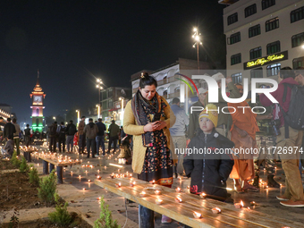 Tourists light candles on the day of Diwali in Srinagar, Indian Administered Kashmir, on October 31, 2024. (