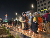 Tourists light candles on the day of Diwali in Srinagar, Indian Administered Kashmir, on October 31, 2024. (