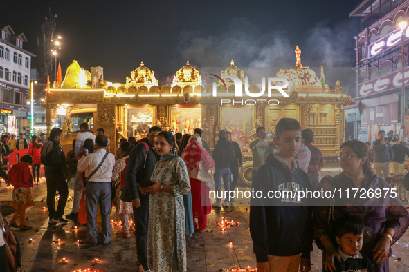 Tourists light candles on the day of Diwali in Srinagar, Indian Administered Kashmir, on October 31, 2024. 