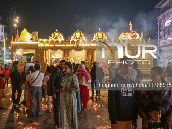 Tourists light candles on the day of Diwali in Srinagar, Indian Administered Kashmir, on October 31, 2024. (