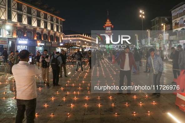 Tourists light candles on the day of Diwali in Srinagar, Indian Administered Kashmir, on October 31, 2024. 