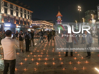 Tourists light candles on the day of Diwali in Srinagar, Indian Administered Kashmir, on October 31, 2024. (