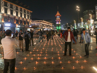 Tourists light candles on the day of Diwali in Srinagar, Indian Administered Kashmir, on October 31, 2024. (