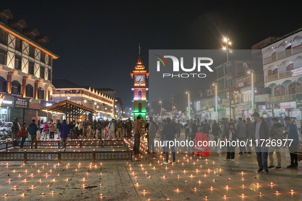 Tourists light candles on the day of Diwali in Srinagar, Indian Administered Kashmir, on October 31, 2024. 