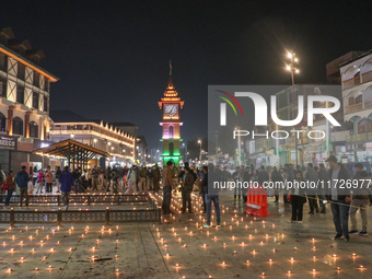 Tourists light candles on the day of Diwali in Srinagar, Indian Administered Kashmir, on October 31, 2024. (