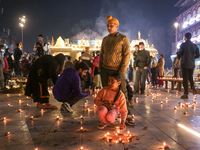 Tourists light candles on the day of Diwali in Srinagar, Indian Administered Kashmir, on October 31, 2024. (