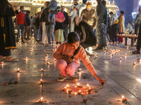 Tourists light candles on the day of Diwali in Srinagar, Indian Administered Kashmir, on October 31, 2024. (