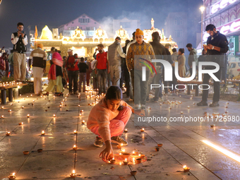 Tourists light candles on the day of Diwali in Srinagar, Indian Administered Kashmir, on October 31, 2024. (