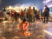 Tourists light candles on the day of Diwali in Srinagar, Indian Administered Kashmir, on October 31, 2024. (