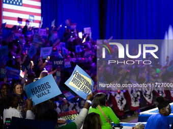 People await remarks by Vice President Kamala Harris at a get out the vote rally in Harrisburg, PA, on October 30, 2024.  Harris and her run...