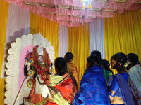 Devotees worship inside a Puja Pandal on the occasion of 'Diwali', the Hindu festival of lights, in Siliguri, India, on October 31, 2024. (