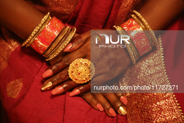 A close-up shows the hands of a Hindu devotee during the festival of Diwali at a Hindu temple in Toronto, Ontario, Canada, on October 31, 20...