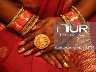 A close-up shows the hands of a Hindu devotee during the festival of Diwali at a Hindu temple in Toronto, Ontario, Canada, on October 31, 20...