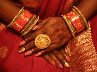 A close-up shows the hands of a Hindu devotee during the festival of Diwali at a Hindu temple in Toronto, Ontario, Canada, on October 31, 20...