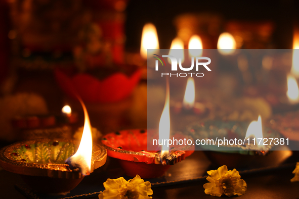 Diyas (small clay lamps) are lit during the festival of Diwali at a Hindu temple in Toronto, Ontario, Canada, on October 31, 2024. 