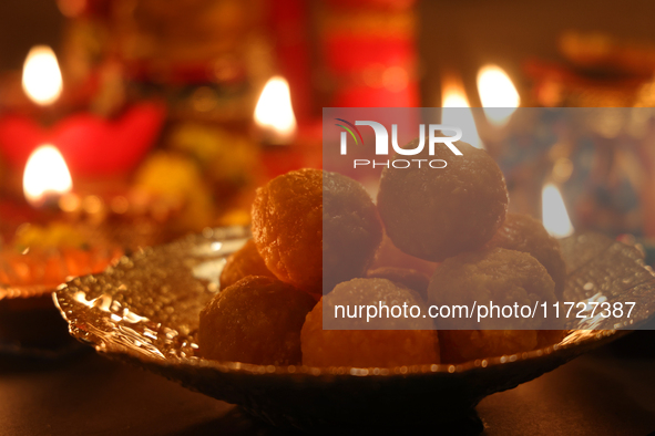 A bowl of ladoos (a traditional Indian sweet) is present during the festival of Diwali at a Hindu temple in Toronto, Ontario, Canada, on Oct...