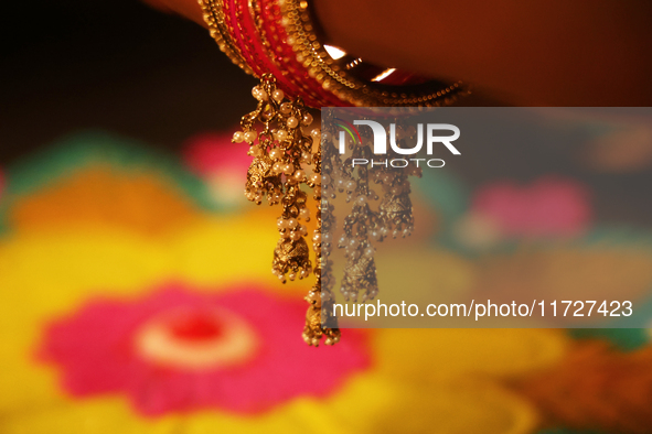 The ornaments on the bangle of a Hindu woman during the festival of Diwali at a Hindu temple in Toronto, Ontario, Canada, on October 31, 202...