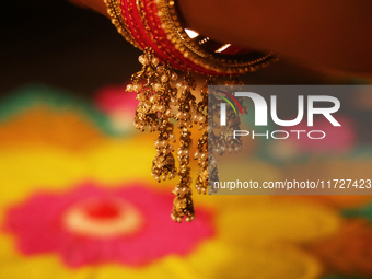 The ornaments on the bangle of a Hindu woman during the festival of Diwali at a Hindu temple in Toronto, Ontario, Canada, on October 31, 202...