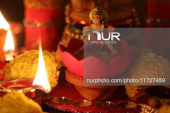 An idol of Goddess Lakshmi is surrounded by diyas (small clay lamps) during the festival of Diwali at a Hindu temple in Toronto, Ontario, Ca...