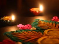 Diyas (small clay lamps) surround a rangoli design during the festival of Diwali at a Hindu temple in Toronto, Ontario, Canada, on October 3...