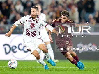 Nikola Vlasic of Torino FC and Tommaso Baldanzi of AS Roma compete for the ball during the Serie A Enilive match between Empoli FC and FC In...