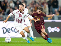 Nikola Vlasic of Torino FC and Tommaso Baldanzi of AS Roma compete for the ball during the Serie A Enilive match between Empoli FC and FC In...