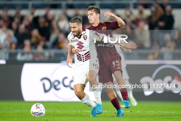 Nikola Vlasic of Torino FC and Tommaso Baldanzi of AS Roma compete for the ball during the Serie A Enilive match between Empoli FC and FC In...