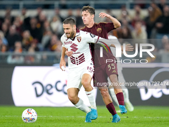 Nikola Vlasic of Torino FC and Tommaso Baldanzi of AS Roma compete for the ball during the Serie A Enilive match between Empoli FC and FC In...