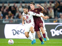 Nikola Vlasic of Torino FC and Tommaso Baldanzi of AS Roma compete for the ball during the Serie A Enilive match between Empoli FC and FC In...