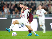 Nikola Vlasic of Torino FC and Tommaso Baldanzi of AS Roma compete for the ball during the Serie A Enilive match between Empoli FC and FC In...