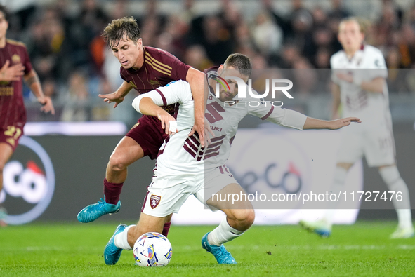 Nikola Vlasic of Torino FC and Tommaso Baldanzi of AS Roma compete for the ball during the Serie A Enilive match between Empoli FC and FC In...