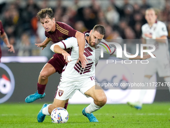 Nikola Vlasic of Torino FC and Tommaso Baldanzi of AS Roma compete for the ball during the Serie A Enilive match between Empoli FC and FC In...