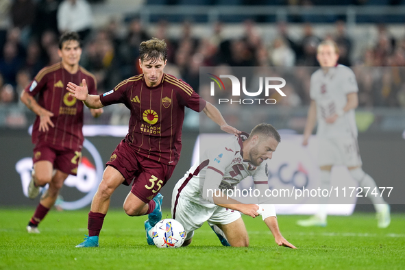 Nikola Vlasic of Torino FC and Tommaso Baldanzi of AS Roma compete for the ball during the Serie A Enilive match between Empoli FC and FC In...