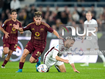 Nikola Vlasic of Torino FC and Tommaso Baldanzi of AS Roma compete for the ball during the Serie A Enilive match between Empoli FC and FC In...