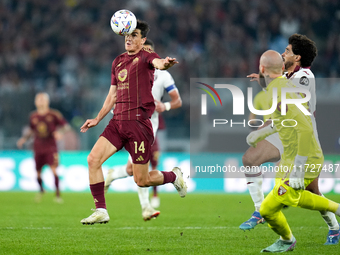 Eldor Shomurodov of AS Roma and Saul Coco of Torino FC compete for the ball during the Serie A Enilive match between Empoli FC and FC Intern...