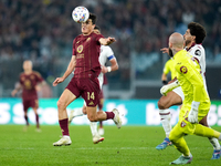 Eldor Shomurodov of AS Roma and Saul Coco of Torino FC compete for the ball during the Serie A Enilive match between Empoli FC and FC Intern...