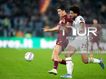 Eldor Shomurodov of AS Roma and Saul Coco of Torino FC compete for the ball during the Serie A Enilive match between Empoli FC and FC Intern...