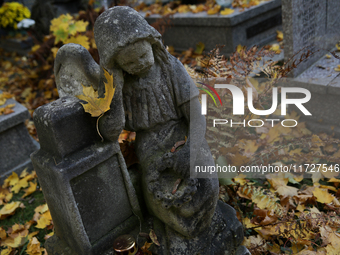 A tombstone in the form of a sculpture stands at the Rakowicki Cemetery during preparations for All Saints' Day in Krakow, Poland, on Octobe...