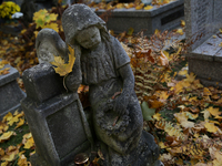 A tombstone in the form of a sculpture stands at the Rakowicki Cemetery during preparations for All Saints' Day in Krakow, Poland, on Octobe...