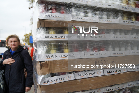 A stand with flowers and candles is next to the Rakowicki Cemetery during preparations for All Saints' Day in Krakow, Poland, on October 30,...