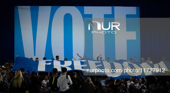 People unfurl a ''freedom'' banner at the conclusion od Vice President Kamala Harris' remarks at a get out the vote rally in Harrisburg, PA,...