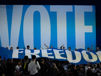 People unfurl a ''freedom'' banner at the conclusion od Vice President Kamala Harris' remarks at a get out the vote rally in Harrisburg, PA,...