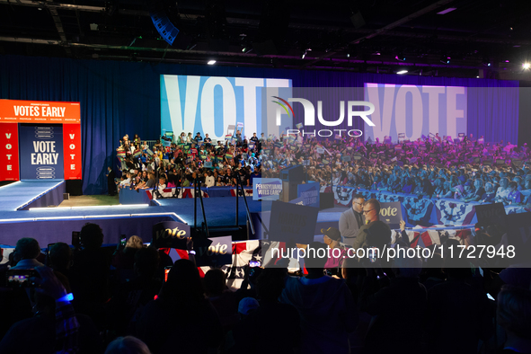 People attend a get out the vote rally with Vice President Kamala Harris in Harrisburg, PA, on October 30, 2024.  Harris and her running mat...