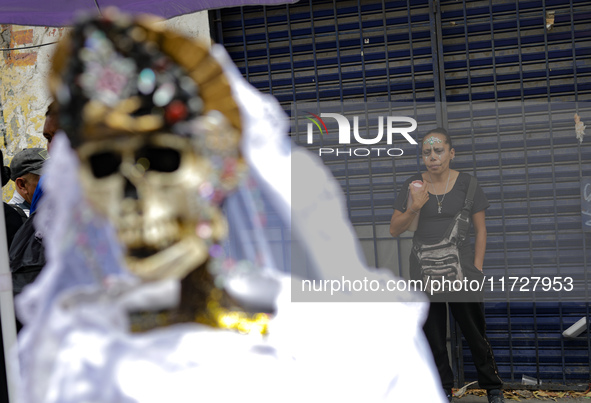 A devotee visits the altar of Santa Muerte located on Alfareria Street in the Tepito neighborhood to show their devotion and give thanks for...