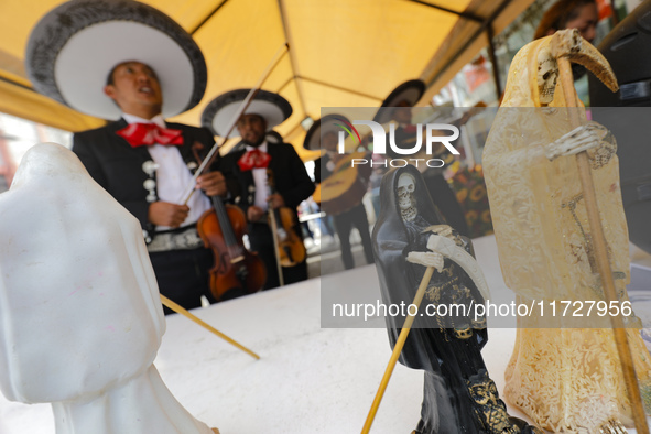 An image of Santa Muerte is seen as devotees attend the Altar of Santa Muerte located on Alfareria Street in the Tepito neighborhood to show...