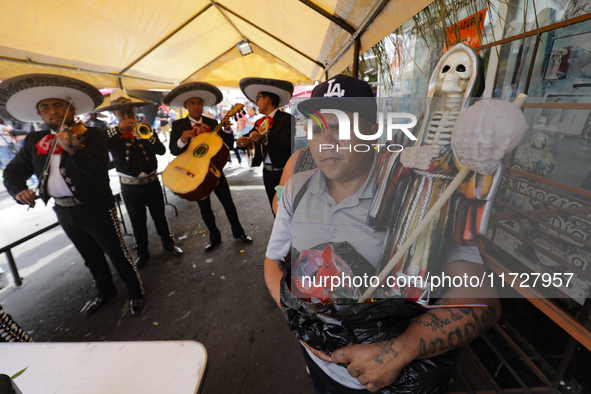 A devotee visits the altar of Santa Muerte located on Alfareria Street in the Tepito neighborhood to show their devotion and give thanks for...