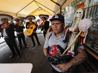 A devotee visits the altar of Santa Muerte located on Alfareria Street in the Tepito neighborhood to show their devotion and give thanks for...